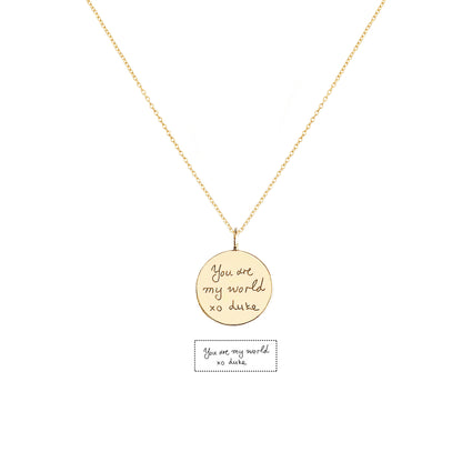 solid yellow gold necklace with a round pendant with custom handwritten engraving 