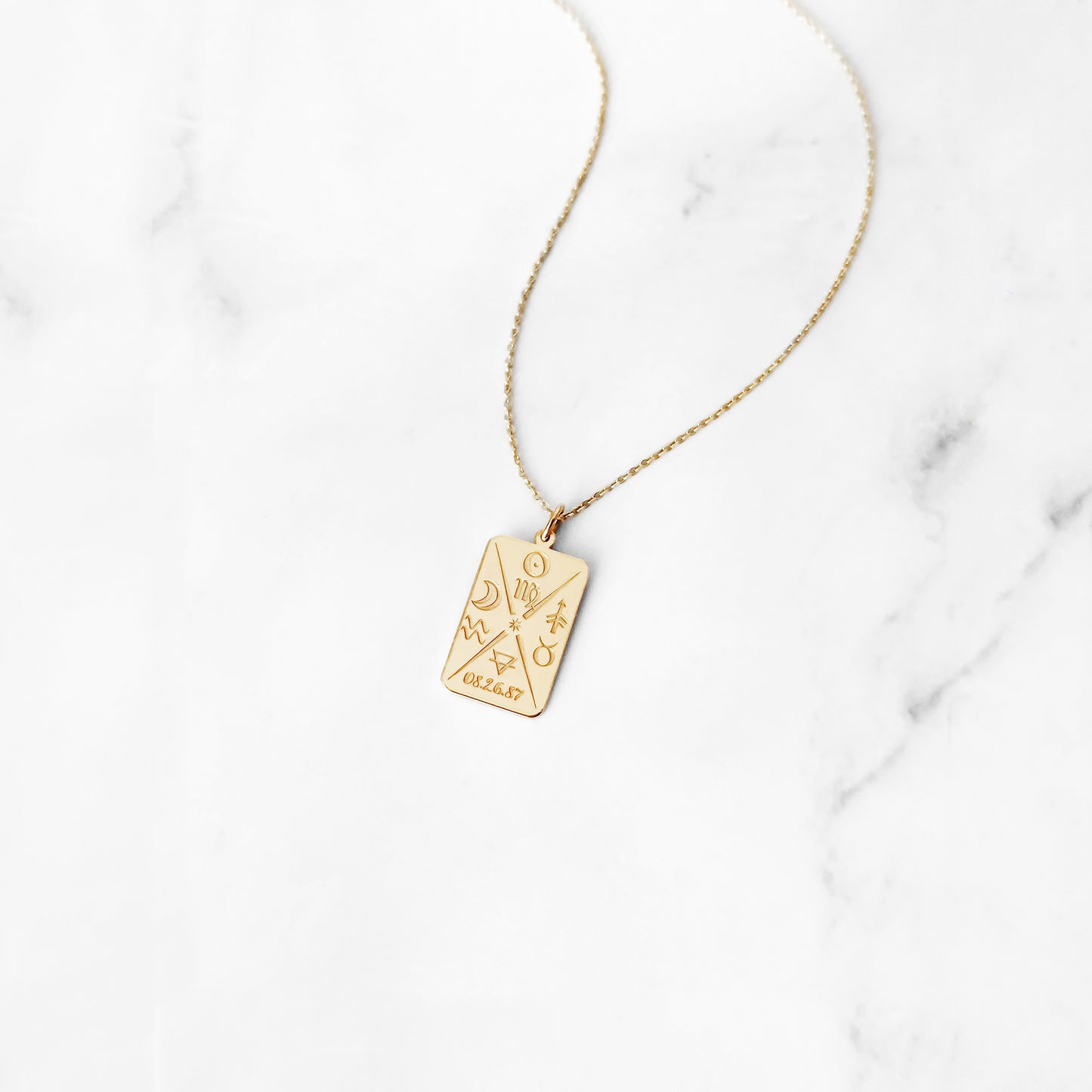 14k yellow gold octagon pendant necklace personalized with natal chart zodiac signs of the sun the moon and ascendant, a birth date and an alchemy element