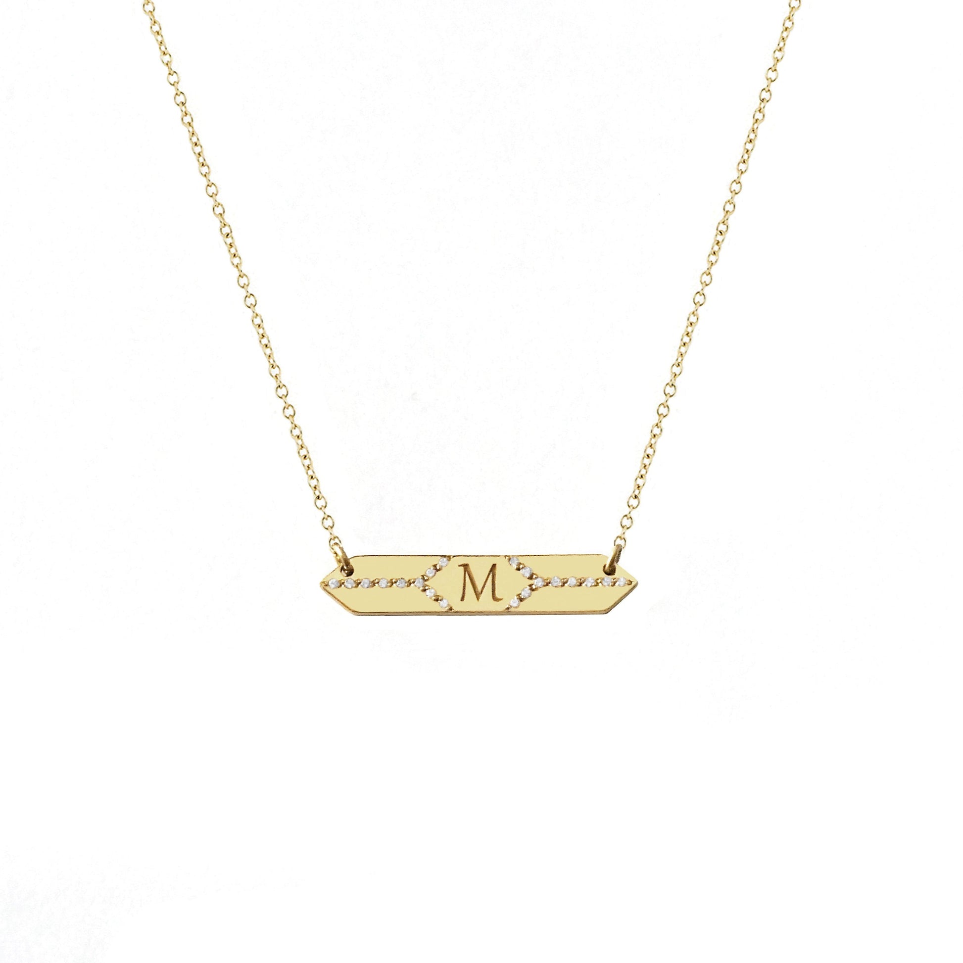solid yellow gold hexagon bar necklace set with white diamonds and engraved with a custom initial/monogram in the center