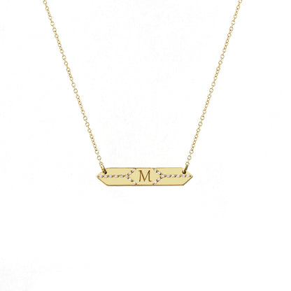 solid yellow gold hexagon bar necklace set with white diamonds and engraved with a custom initial/monogram in the center