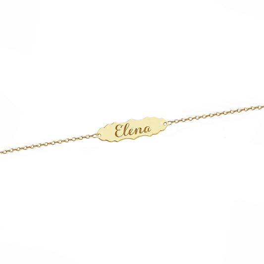 solid yellow gold bracelet with a vintage baroque inspired bar engraved with a name