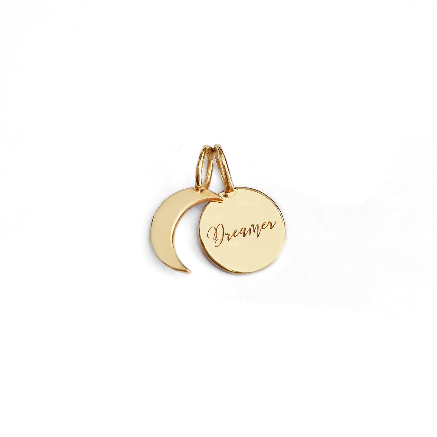 two small solid yellow gold charms, a crescent moon and a personalized disc
