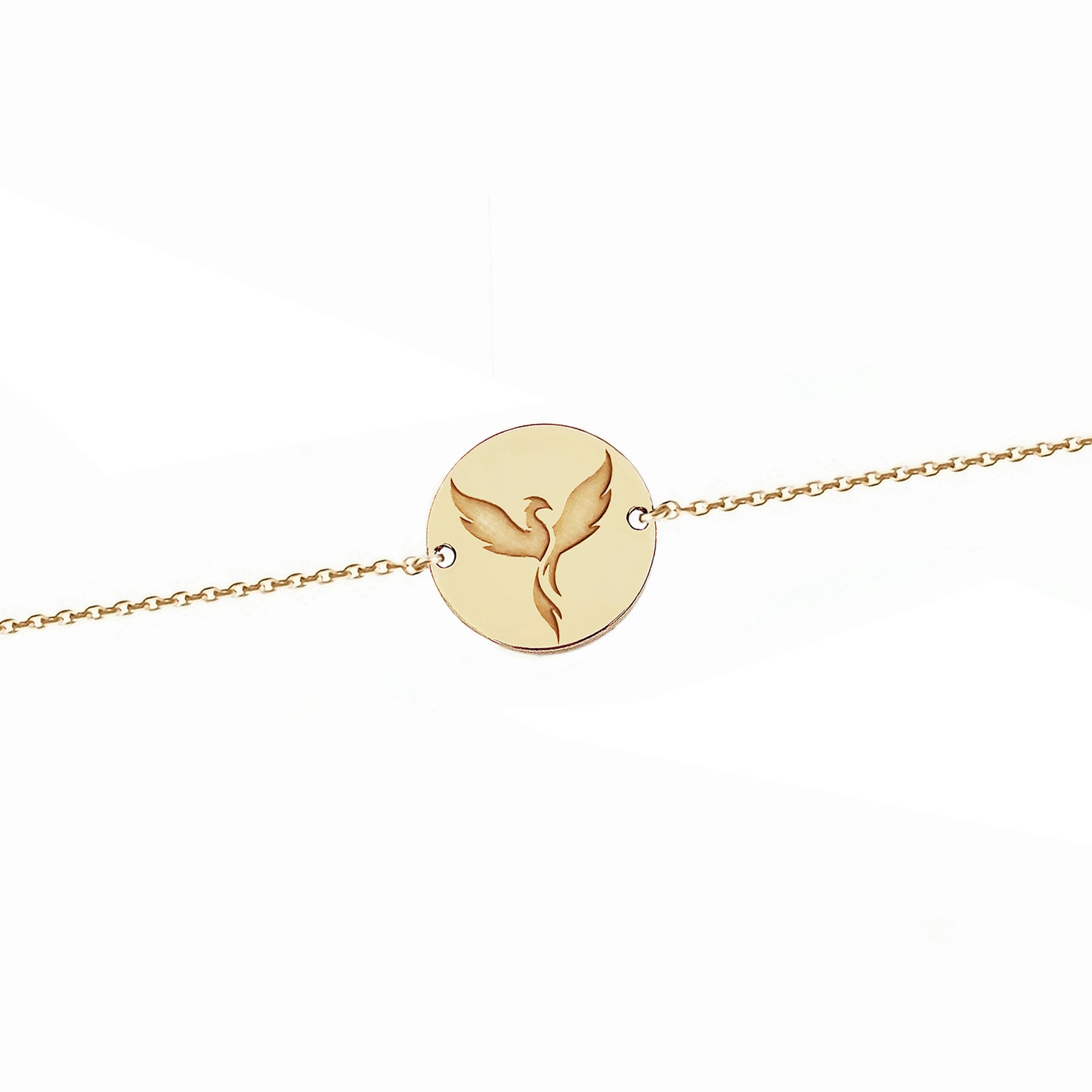 solid yellow gold bracelet with a 14mm disc charm engraved with a phoenix firebird rising