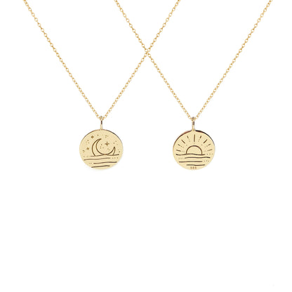 solid yellow gold necklace with reversible pendant engraved with a moon on one side and a sun on the other side 