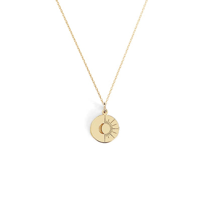 solid yellow gold disc pendant necklace engraved with a crescent moon and sun rays