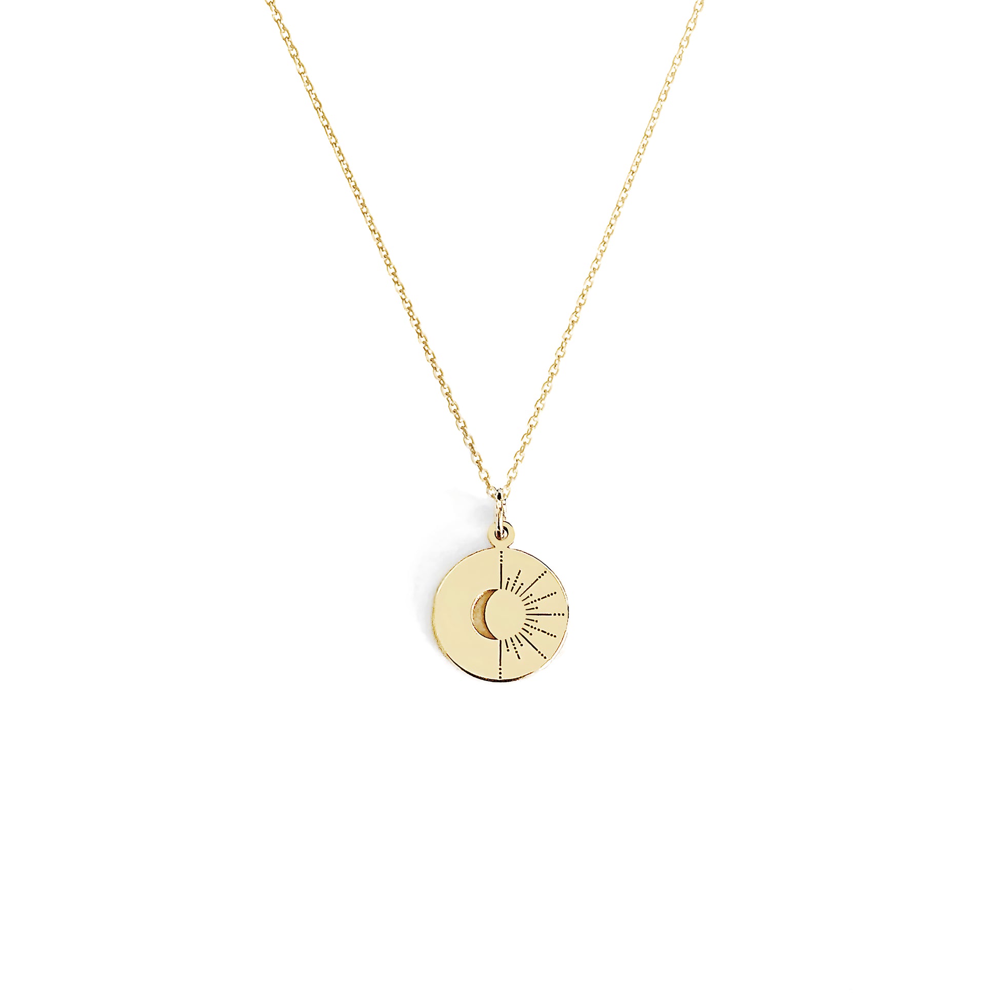 solid yellow gold disc pendant necklace engraved with a crescent moon and sun rays