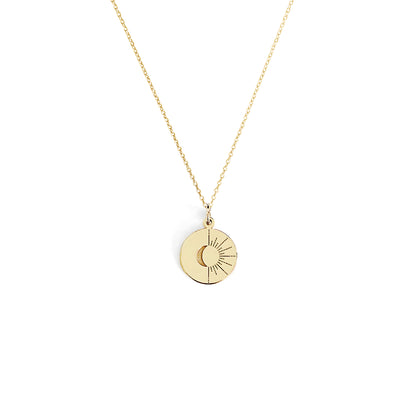 solid yellow gold disc pendant necklace engraved with a crescent moon and sun rays