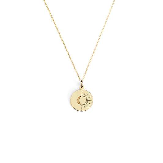 solid yellow gold disc pendant necklace engraved with a crescent moon and sun rays