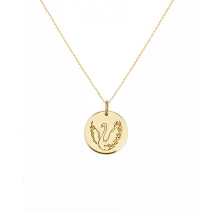 solid yellow gold necklace with a 14mm disc pendant engraved with a swan with open wings