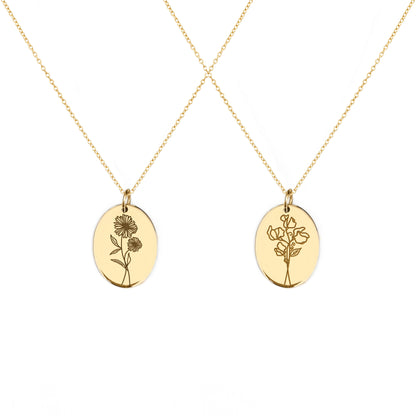two solid yellow gold oval pendant necklaces engraved with the birth flowers of April Daisy and Sweet Pea
