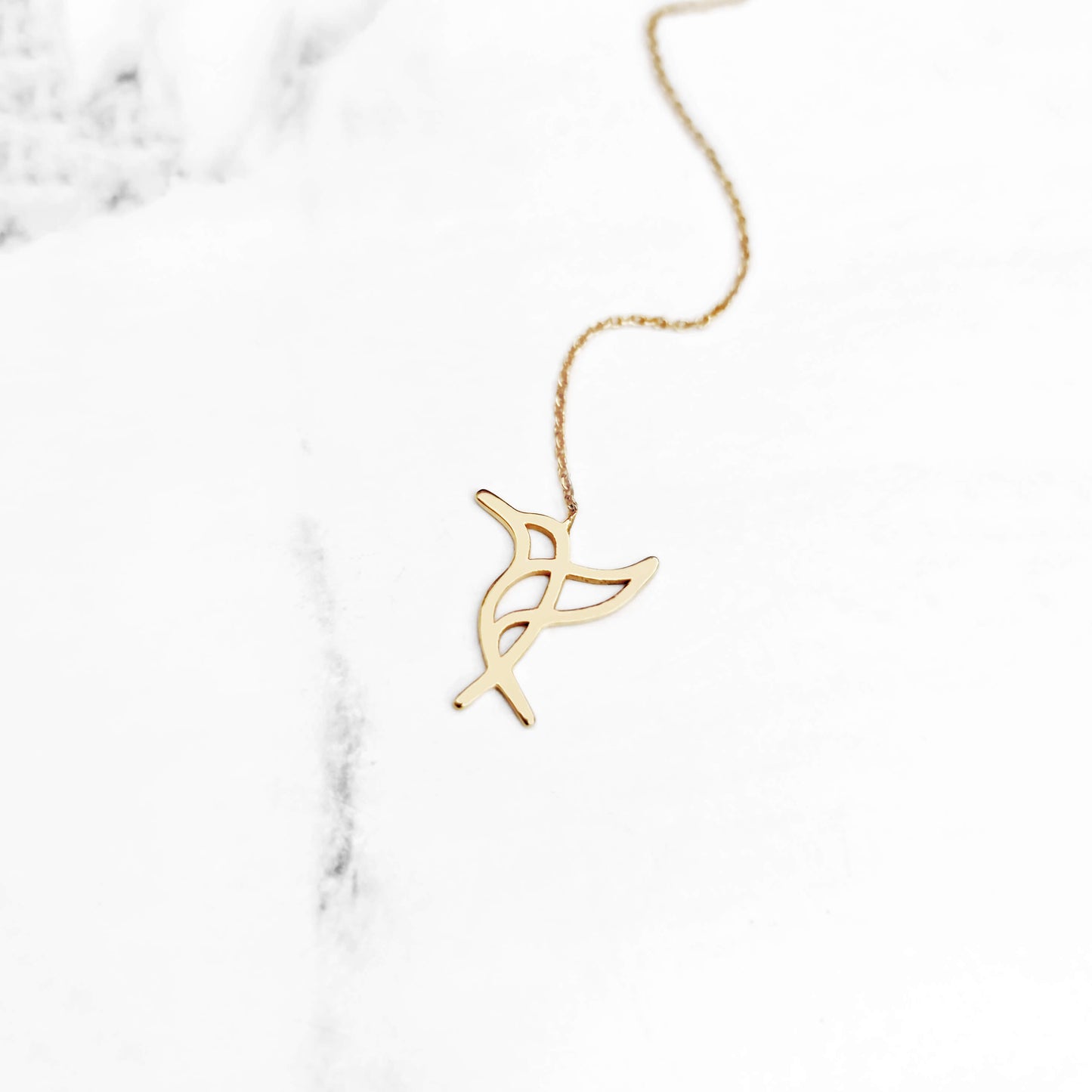 Yellow gold hummingbird threader earring