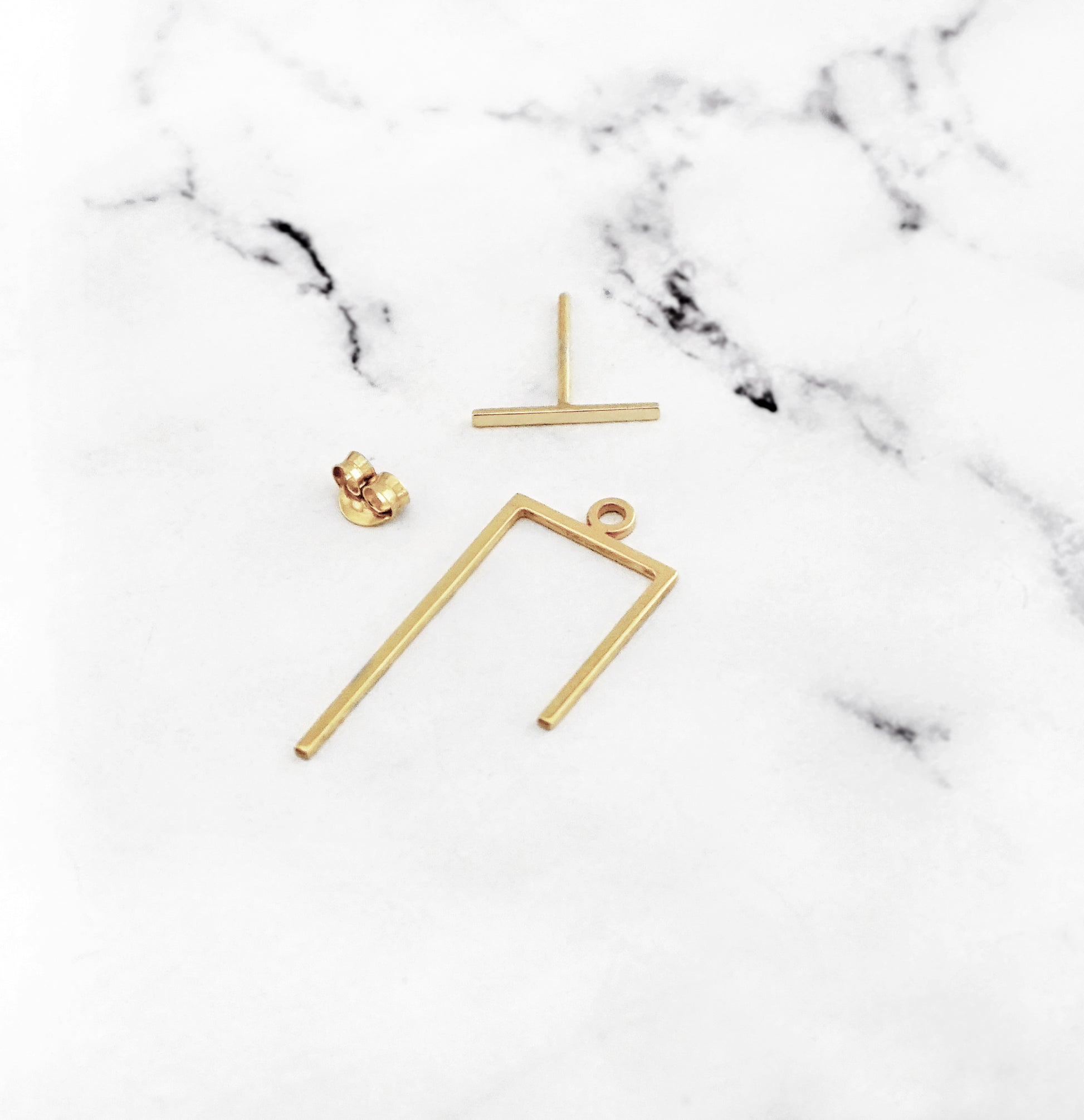 the three pieces of an ear jacket in yellow gold